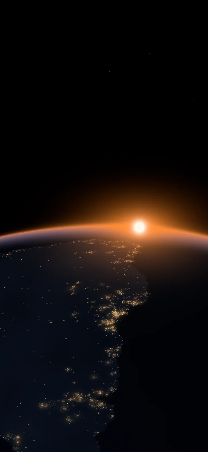 Orange Earth Dawn over City Lights wallpaper for iPhone and Android