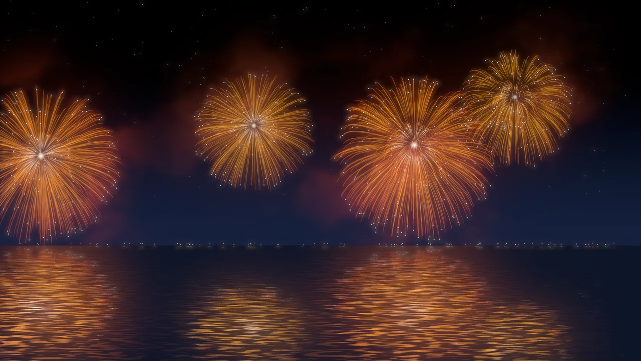 Orange Fireworks Over Water desktop wallpaper in 4K